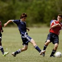 men playing soccer