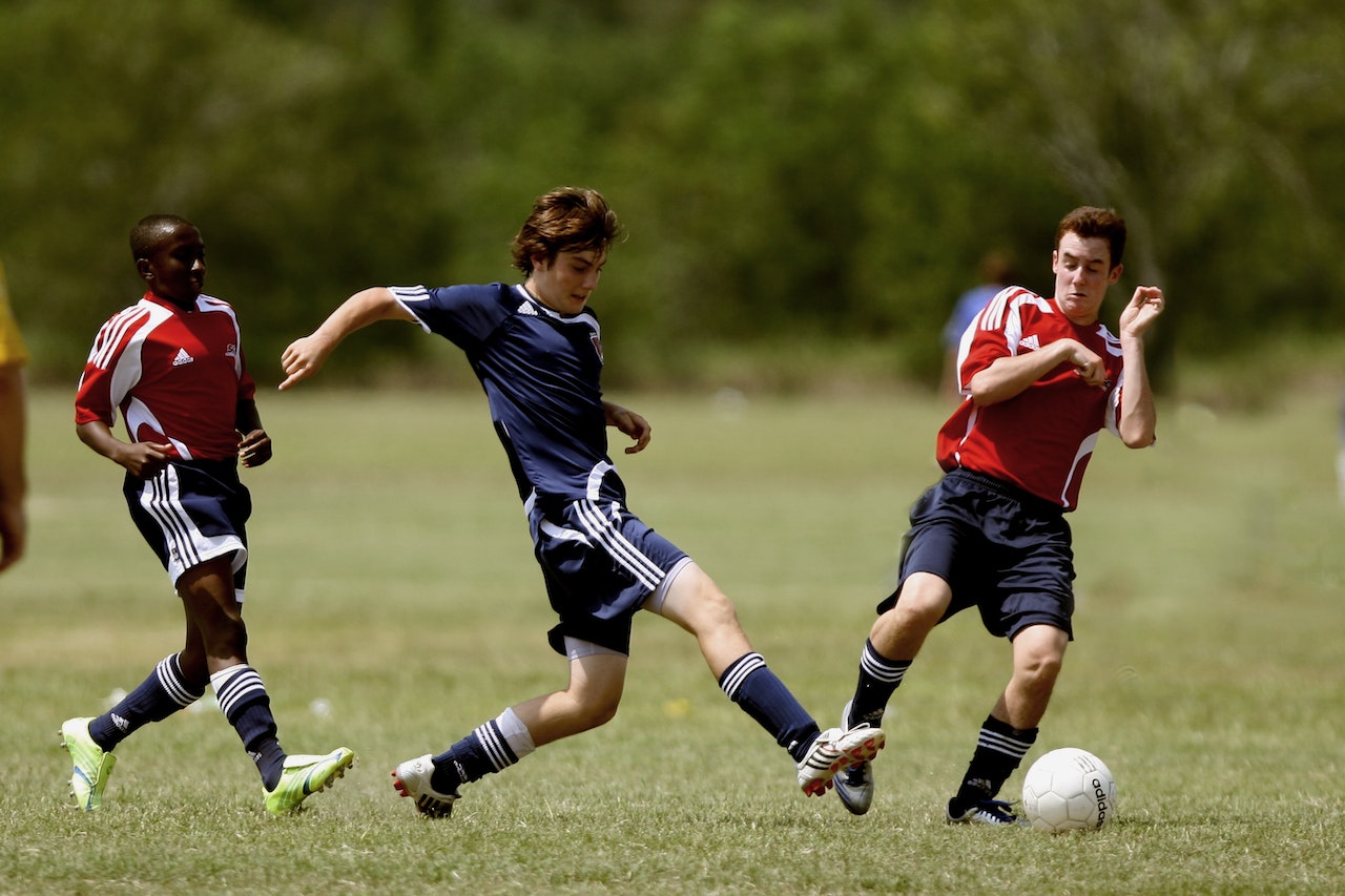 men playing soccer