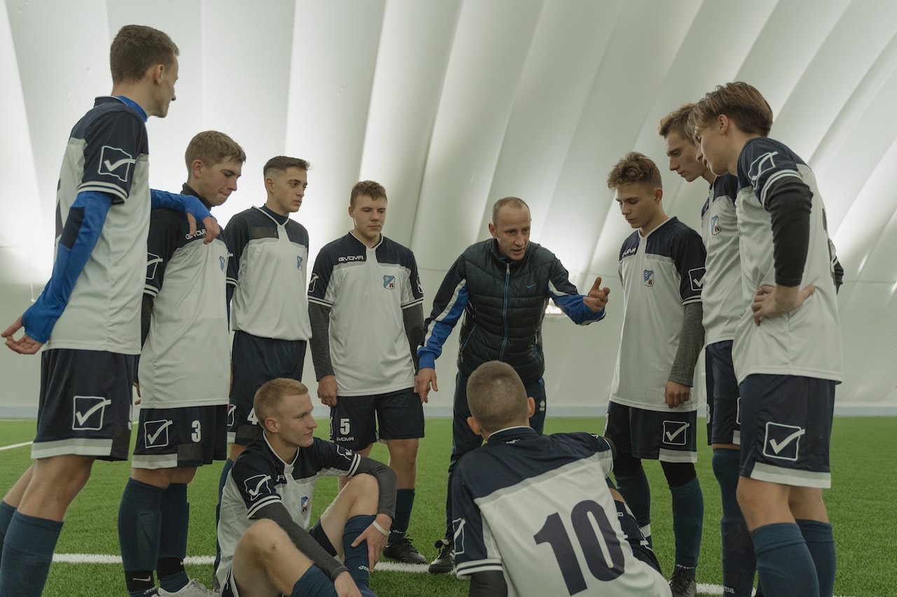 coach talking to team