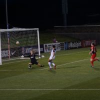 women playing football