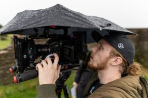Videographer in the rain