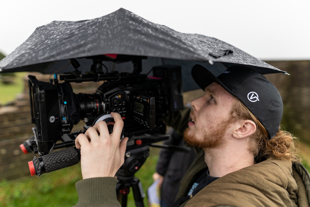 Videographer in the rain
